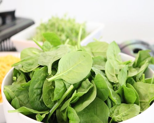 Fresh green spinach leaves close up